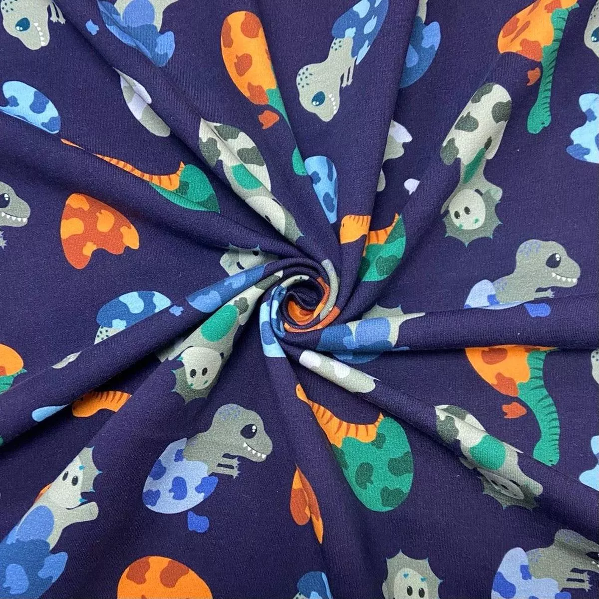 hatching-dinosaurs-brushed-cotton-jersey-fabric Hatching Dinosaurs Brushed Cotton Jersey Fabric